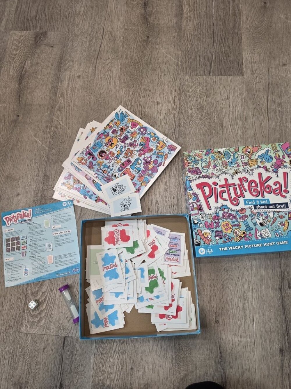 Pictureka! The Wacky Picture Hunt Game By Hasbro comes with everything shown